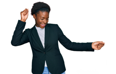 Young african american girl wearing business clothes dancing happy and cheerful, smiling moving casual and confident listening to music