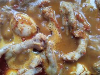 Ready to eat. Chicken feet and spicy egg rendang sauce or 
