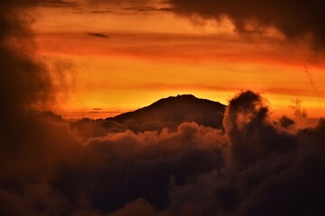 Silhouette of Mount Meru, a dormant stratovolcano and the second highest mountain in Tanzania (4562...