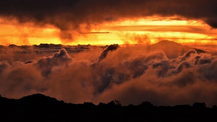 Silhouette of Mount Meru, a dormant stratovolcano and the second highest mountain in Tanzania (4562 m), as observed at dusk from the vicinity of Shira Camp on Mount Kilimanjaro (Tanzania, Africa)