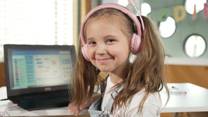 Smiling smart caucasian girl show system programing or coding program in STEM technology education....