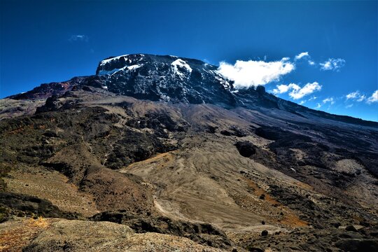 Kibo volcanic cone with Uhuru Peak (5895 m, the top of Mt. Kilimanjaro) on its rim as seen from the viewpoint above Barranco Wall, Machame Route (Kilimanjaro National Park, Tanzania)