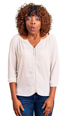Young african american woman wearing casual clothes scared and amazed with open mouth for surprise, disbelief face