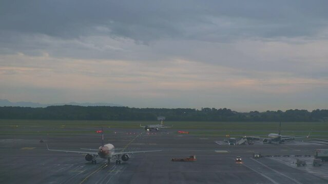 Malpensa airport, Italy - 9 may 2024: timelapse of airplanes arriving and departing in a rainy day