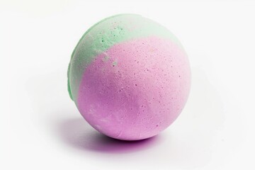 Obraz premium Bath bomb isolated on a white background. Fresh, clean look of a spherical bath accessory. Concept of spa, relaxation, hygiene, freshness, wellness and personal care.