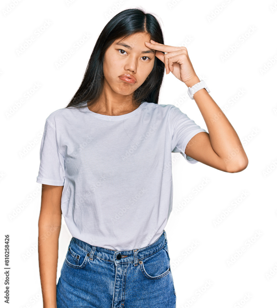 Canvas Prints Beautiful young asian woman wearing casual white t shirt worried and stressed about a problem with hand on forehead, nervous and anxious for crisis