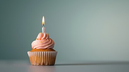 Minimalist depiction of a forgotten birthday, lone cupcake and unlit candle, isolated background
