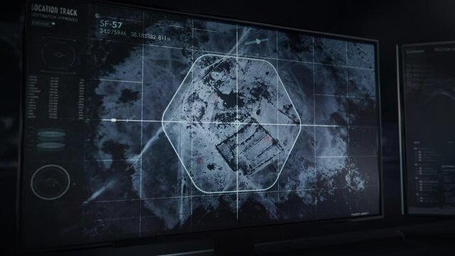 Computer monitor. Advanced software. Location track. The modern software help the FBI to use signals from satellites to trace the location base of a human trafficking gang in the desert of Syria