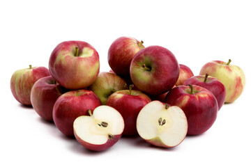 pile of red McIntosh or Cortland apples and a cut apple isolated on white