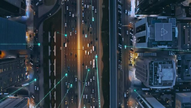 Aerial Drone Shot Autonomous Self Driving Cars Moving Through City Surveillance System Artificial Intelligence Scans Cars GPS Tracking Movement 5G Connection Satellite IoT Network
