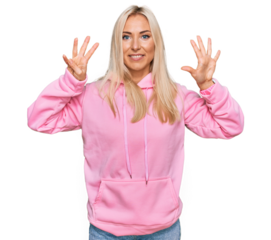 Young blonde woman wearing casual sweatshirt showing and pointing up with fingers number nine while smiling confident and happy.