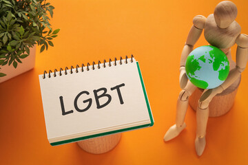 There is notebook with the word LGBT. It is an abbreviation for Lesbian, Gay, Bisexual, Transgender as eye-catching image.