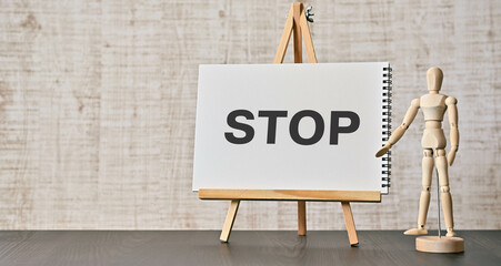 There is notebook with the word STOP. It is as an eye-catching image.
