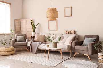 Modern living room with cosy white sofa and bamboo plant