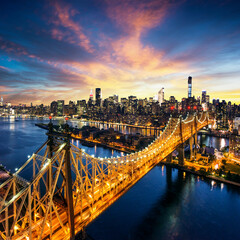 Majestic sunset over new york city skyline and bridge