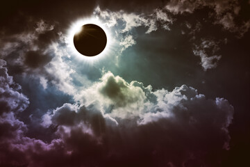 Total solar eclipse with dramatic cloudscape