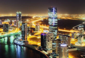 Vibrant night view of a bustling city with skyscrapers and illuminated streets