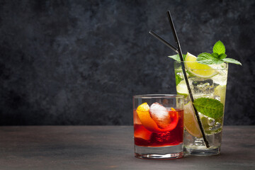 Refreshing cocktails on dark background