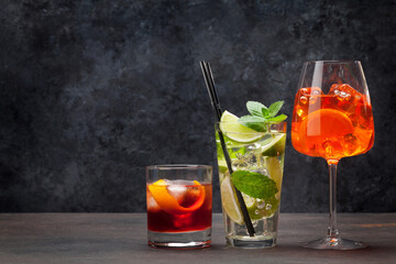 Assorted refreshing cocktails on rustic background