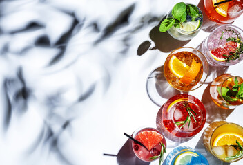 Assorted refreshing cocktails in sunlight