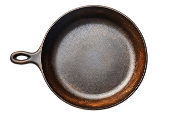 Black cast iron skillet isolated on black background. Top view.