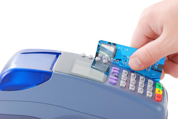 Hand swiping credit card through payment terminal