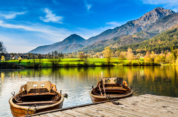 Serene lakeside view with rowboats