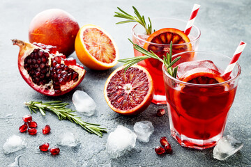 Fresh pomegranate and blood orange cocktails with ice