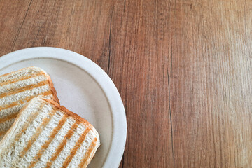 Grilled toasted sandwiches on plate. Everyday food. Two slices of delicious crusty bread for lunch.