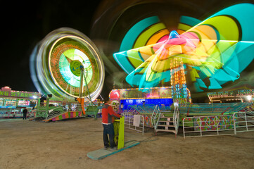 fortune wheel in motion blur, fair at night. Mexicali baja california Mexico. Photography technic....