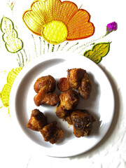 fried pork served on white porcelain plate