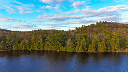 Typical Canadian landscape a lake surrounded by pine trees - travel photography