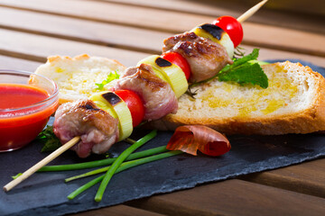 Shish kebab from mutton marinated in red wine with mint, aromatic herbs and spices khmeli suneli...