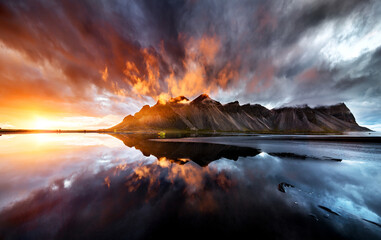 Majestic sunset over mountain reflection