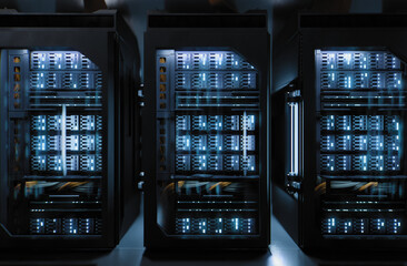 Modern data center server racks illuminated in dark room