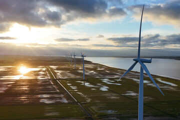 Sunset over wind farm landscape