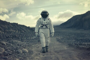 an astronaut in a white suit walks towards the camera - Powered by Adobe