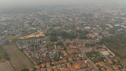 Aerial view of an environment in Chiang Rai city covered with bad air pollution such as PM 2.5.