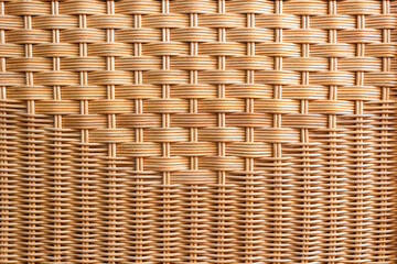 Pattern of rattan furniture close-up. Wooden wicker background. Selective focus