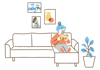 Woman reading a book on the living room sofa_Color