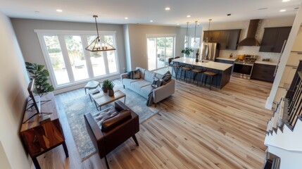 Modern spacious living room seamlessly connected to a stylish open kitchen featuring minimalist interior design and natural light