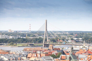 Panorama of the Daugava river in Riga, latvia, with a focus on Vansu tilts, or vansu bridge, in front of old riga. Riga is the capital city of Latvia, Vansu is a cable stayed bridge.