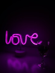 Neon Love Sign and a Glass of Wine