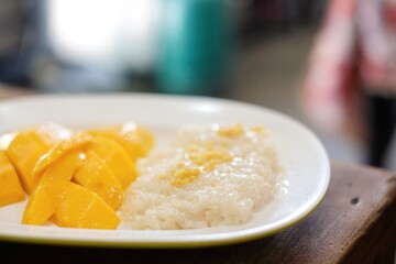 Mango with sticky rice and sweetened condensed milk at Thong Heng Lee, a family-run street food...