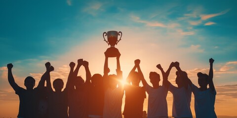 Fototapeta premium Silhouettes Winning team is holding trophy in hands.