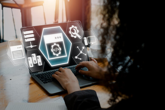 Python concept, Businesswoman using laptop computer on desk with python icon on virtual screen.