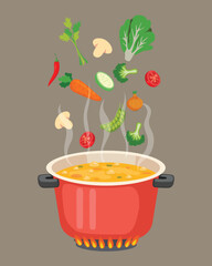 Boiled vegetables soup in pot on the stove as cooking concept