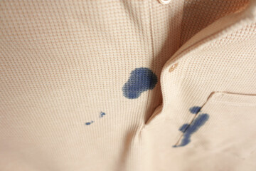  shirt with blue ink stain .