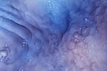 abstract art background in blue and purple colors with a space theme