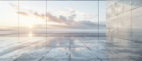 A large empty room with a view of the ocean and a sunset